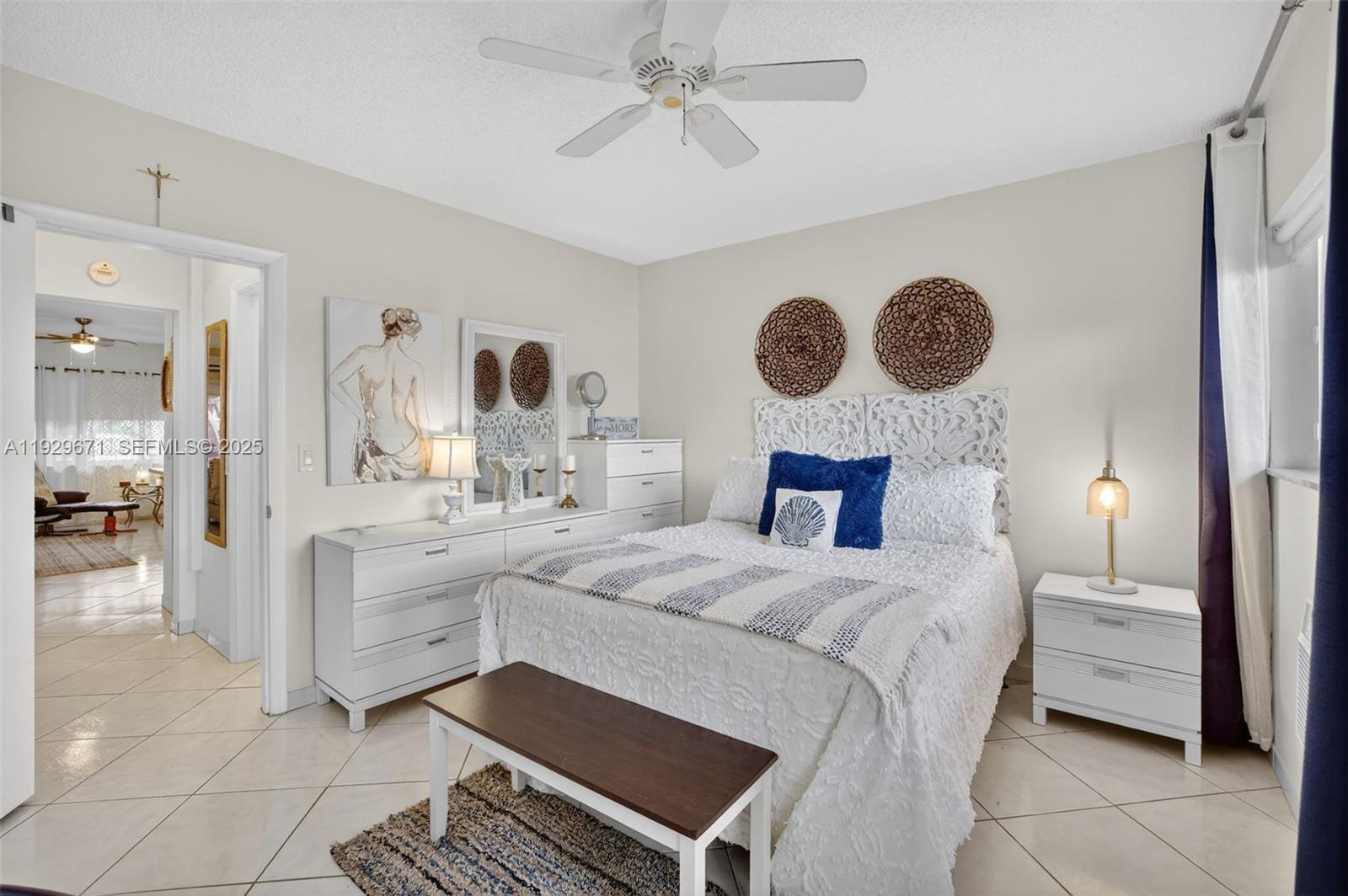 800 Southwest 10th Terrace, Unit 4T Hallandale Beach, FL 33009 - Photo 16 of 39 a bedroom with a bed and a chandelier