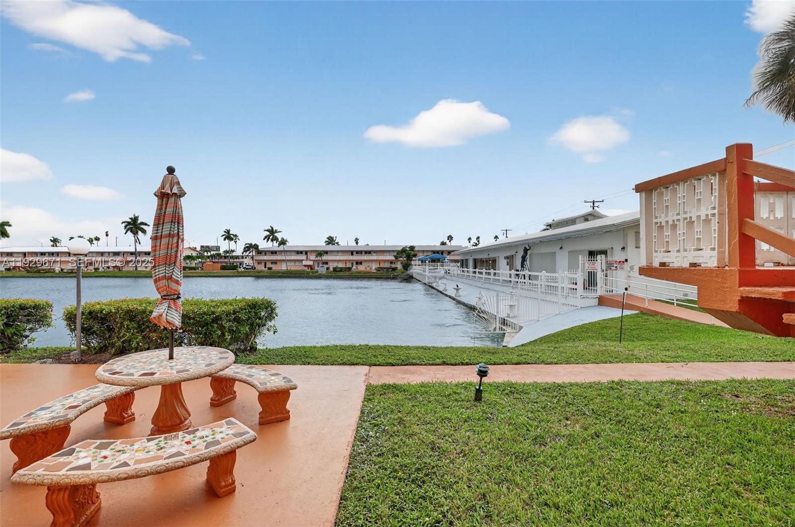 800 Southwest 10th Terrace, Unit 4T Hallandale Beach, FL 33009 - Photo 25 of 39 a view of a swimming pool and a yard