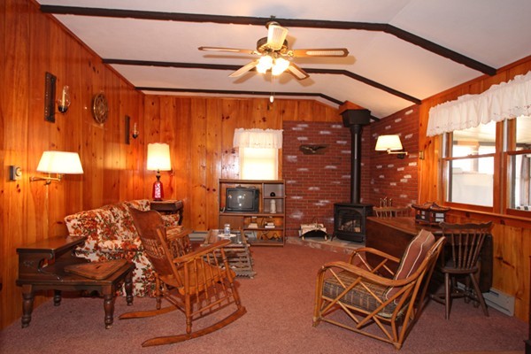 9 Island Road Ashburnham, MA 01430 - Photo 4 of 11 a living room with furniture a lamp and a large window