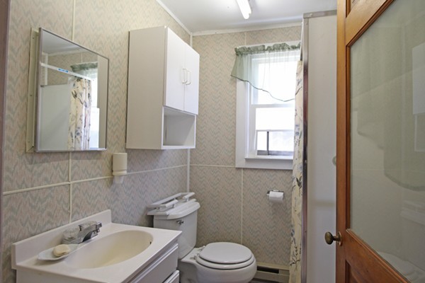 9 Island Road Ashburnham, MA 01430 - Photo 8 of 11 a bathroom with a toilet sink vanity and mirror