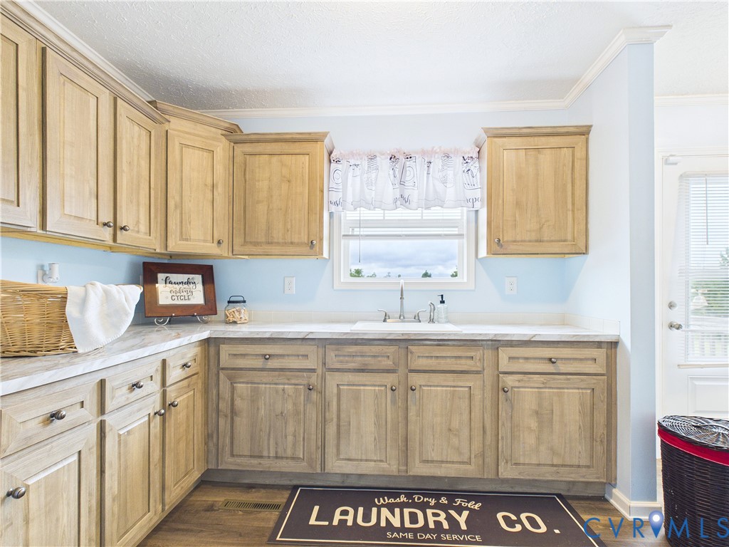 2392 Rehoboth Road Victoria, VA 23974 - Photo 28 of 81 Utility room featuring extensive wood cabinetry, l