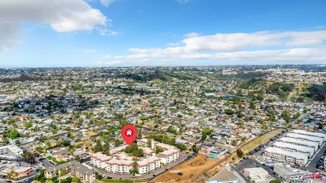 an aerial view of residential building and car parked