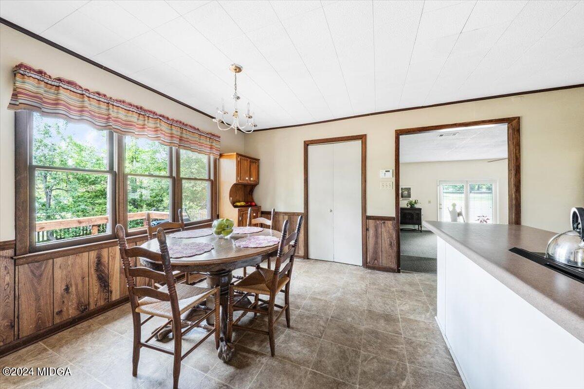 6271 Stapleton Road Macon, GA 31206 - Photo 11 of 41 a view of a dining room with furniture window and outside view