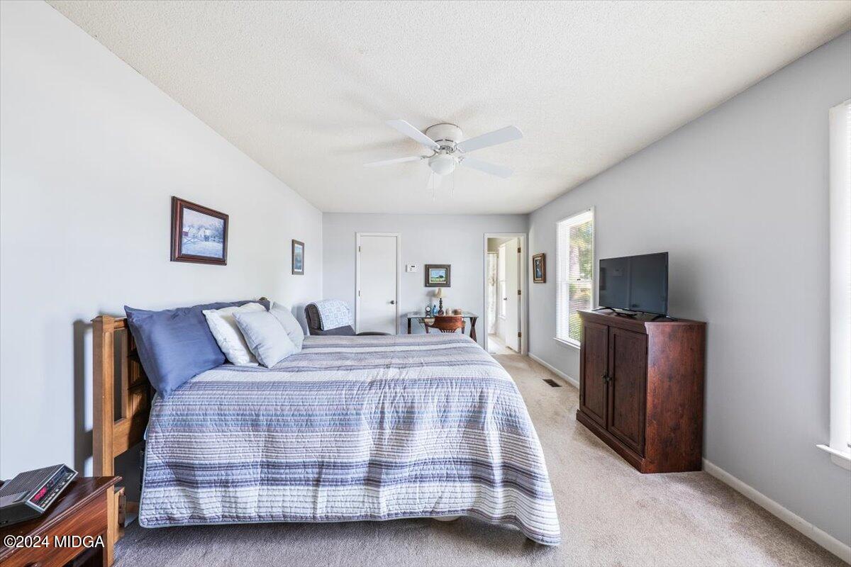 6271 Stapleton Road Macon, GA 31206 - Photo 13 of 41 a bedroom with bed and flat screen tv