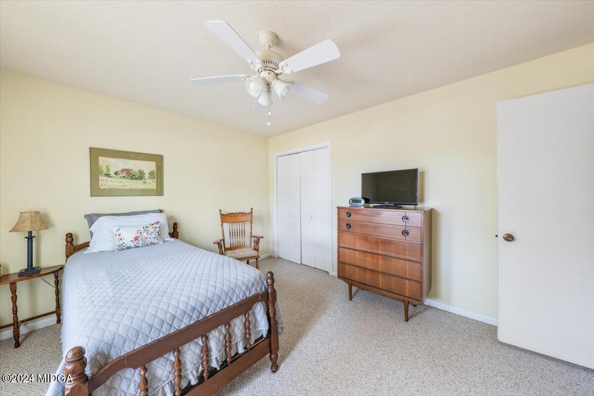 6271 Stapleton Road Macon, GA 31206 - Photo 17 of 41 a bedroom with a bed and furniture