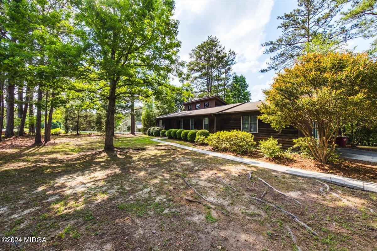 6271 Stapleton Road Macon, GA 31206 - Photo 35 of 41 a front view of a house with a yard and tree