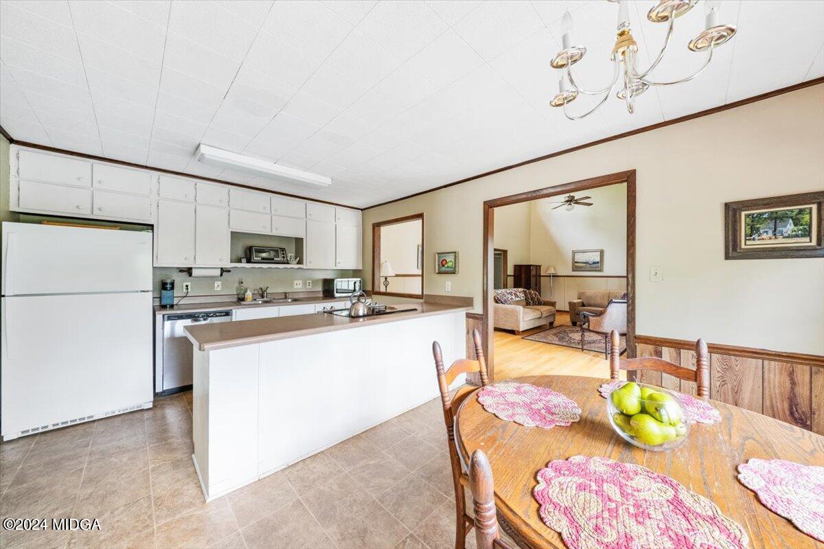 6271 Stapleton Road Macon, GA 31206 - Photo 9 of 41 a room with stainless steel appliances kitchen island granite countertop furniture and a refrigerator