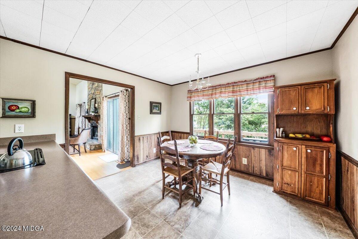 6271 Stapleton Road Macon, GA 31206 - Photo 10 of 41 a dining room with furniture and wooden floor