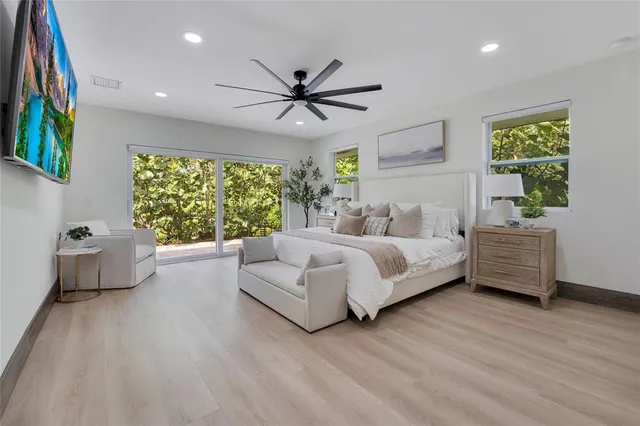 a bedroom with a bed and a couch