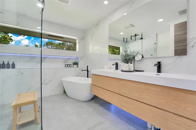 a bathroom with a sink a toilet and bathtub