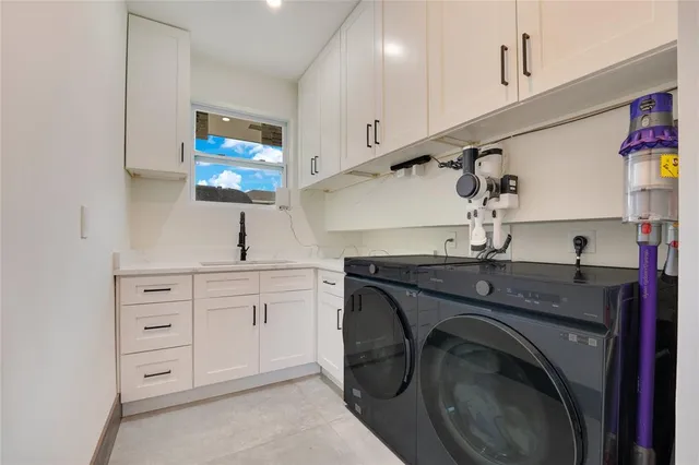 a utility room with cabinets