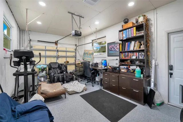 a room with lots of wooden furniture and a book shelf