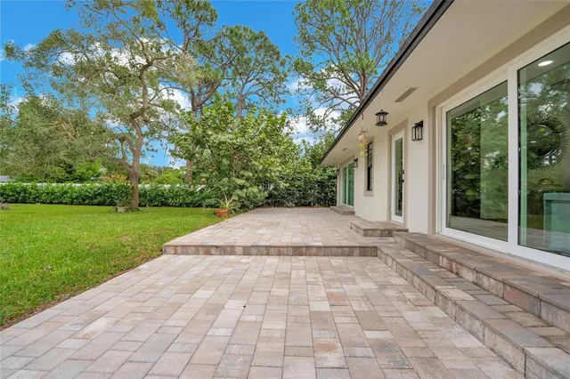 a view of backyard with green space