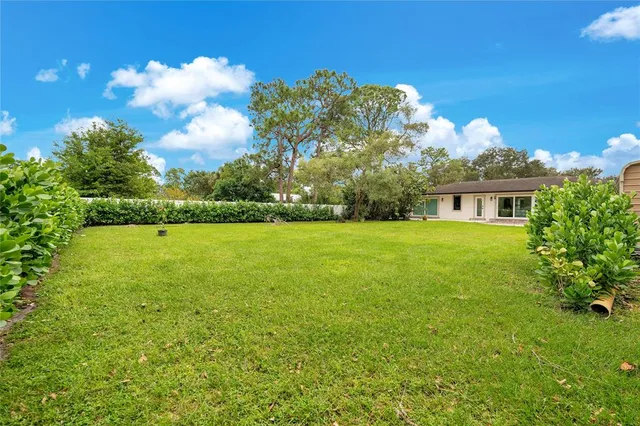a view of a house with a big yard