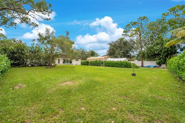 a view of a house with a big yard