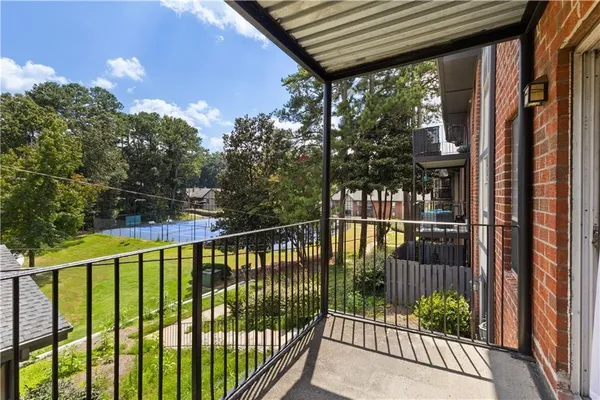 a view of a backyard with sitting area and furniture
