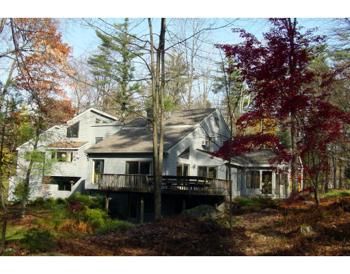a view of house with yard