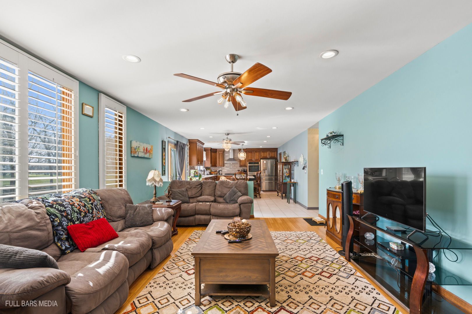 535 Denoyer Trail Wheeling, IL 60090 - Photo 12 of 45 a living room with furniture and a flat screen tv
