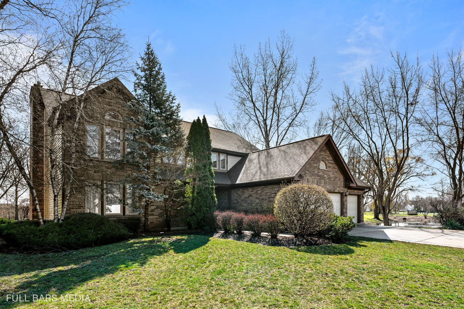 535 Denoyer Trail Wheeling, IL 60090 - Photo 2 of 45 a front view of a house with a yard and garage