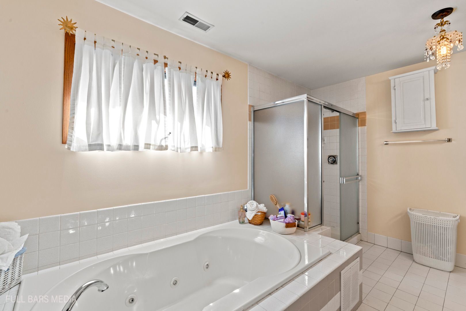 535 Denoyer Trail Wheeling, IL 60090 - Photo 21 of 45 a bathroom with a tub a sink and a large mirror