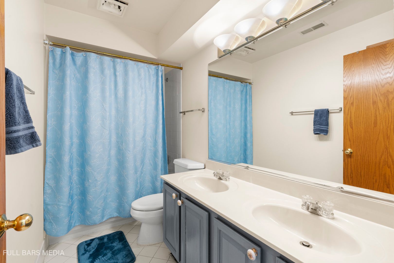 535 Denoyer Trail Wheeling, IL 60090 - Photo 27 of 45 a bathroom with a sink toilet and shower