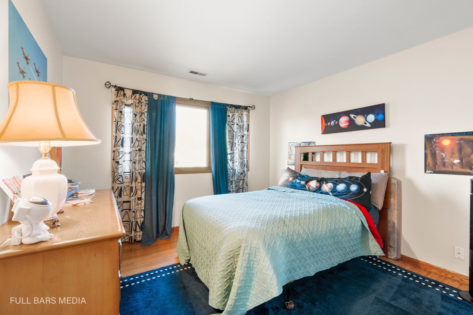 535 Denoyer Trail Wheeling, IL 60090 - Photo 29 of 45 a bedroom with a bed and a lamp