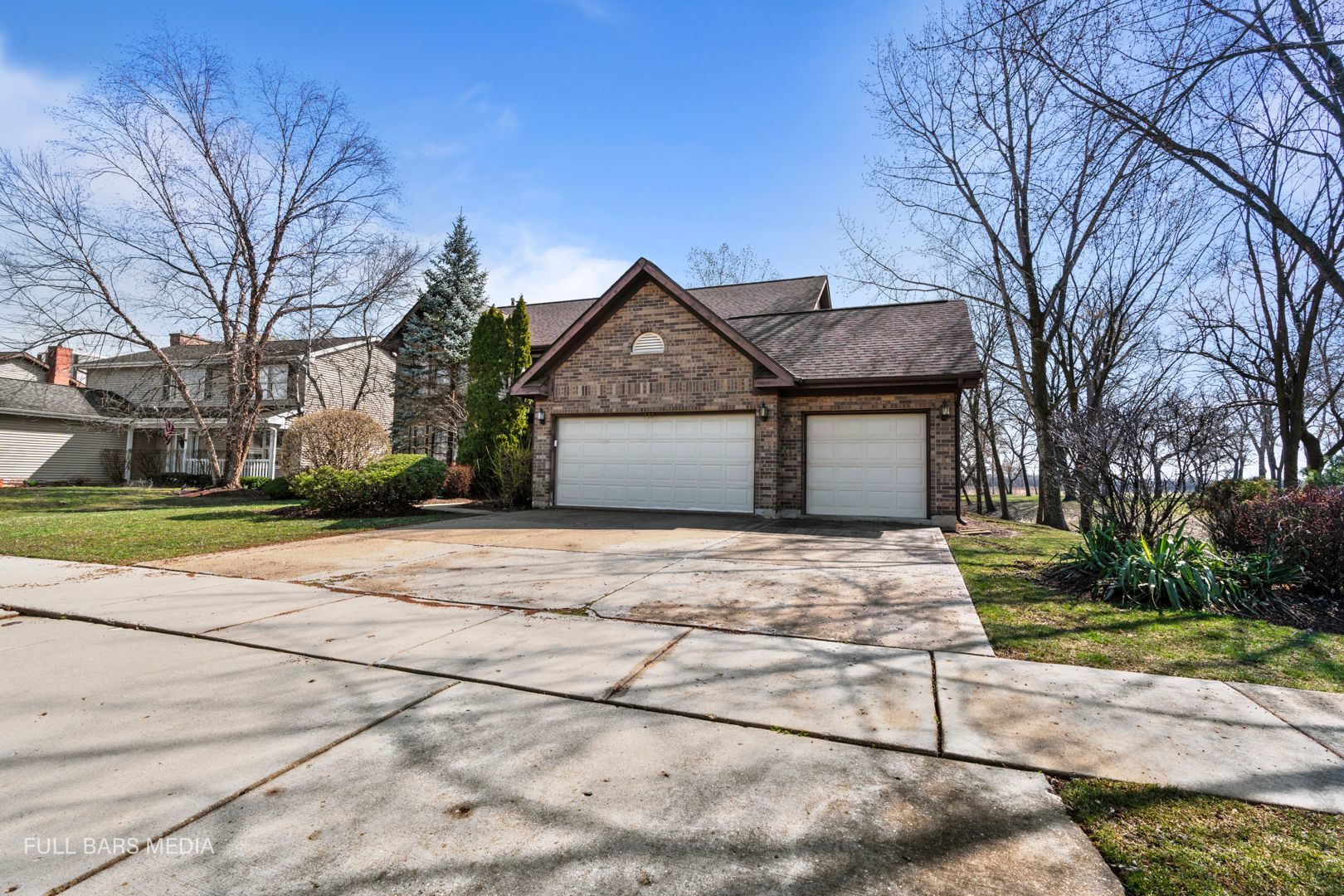 535 Denoyer Trail Wheeling, IL 60090 - Photo 3 of 45 a front view of a house with a garden and trees