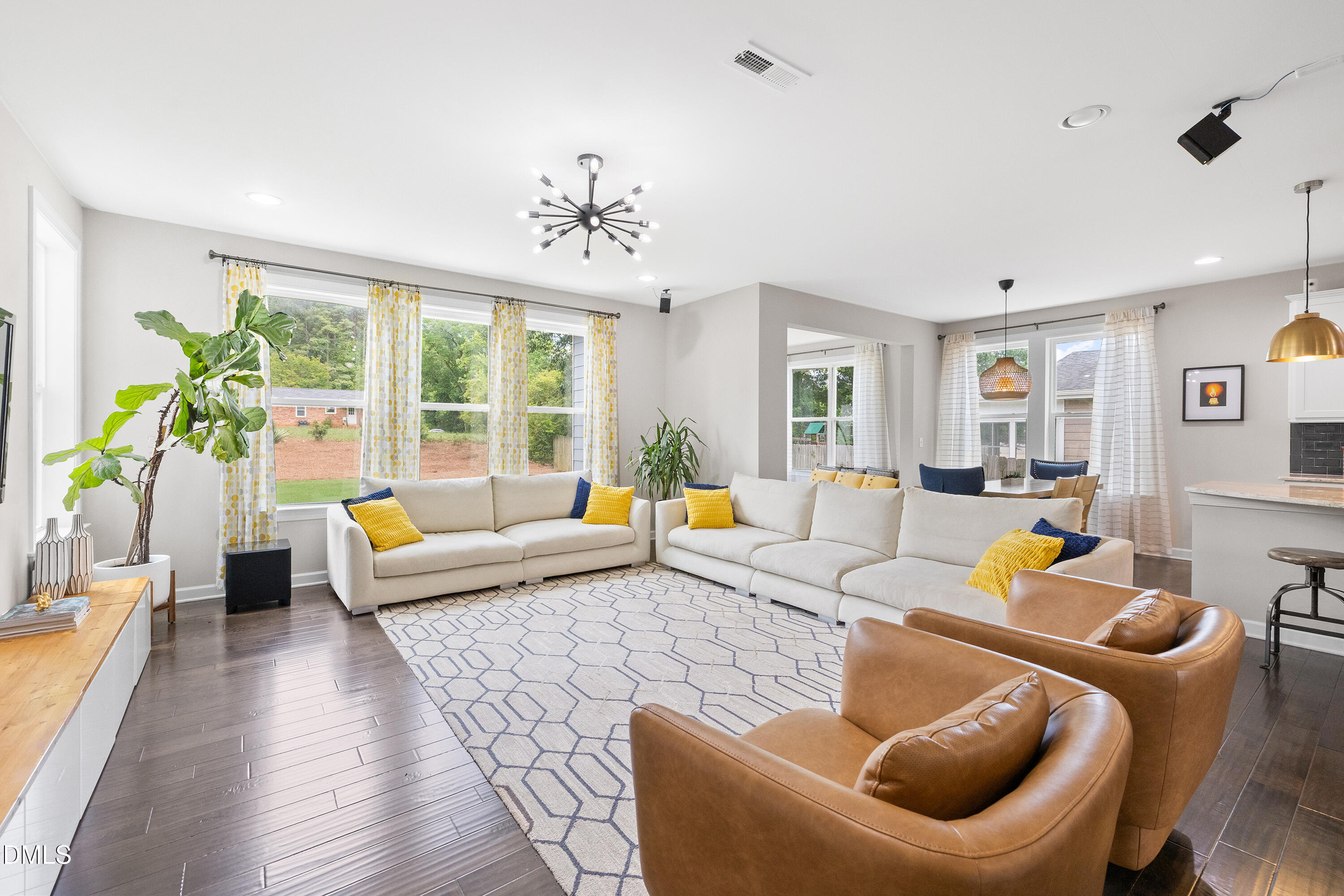 8059 Gilano Drive Raleigh, NC 27603 - Photo 22 of 43 a living room with furniture and a large window