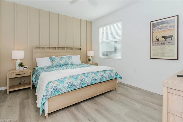 a bedroom with a bed and window