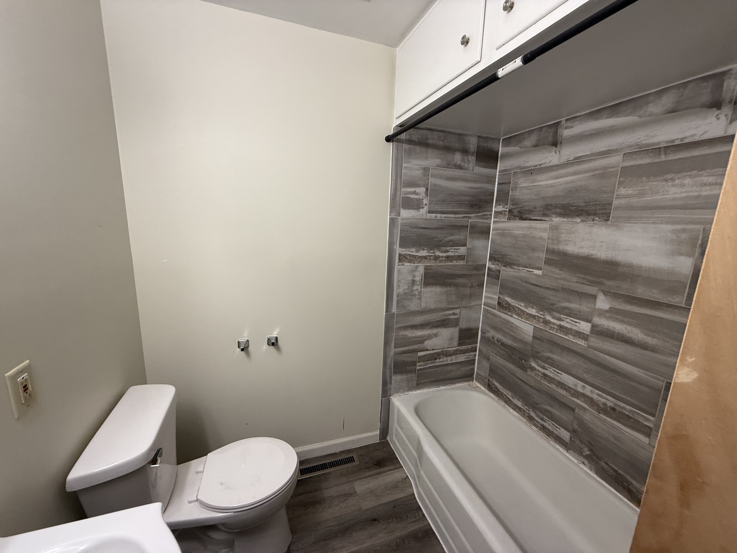 1060 West Hickory Street, Unit 1064 Kankakee, IL 60901 - Photo 5 of 6 a bathroom with a toilet and shower