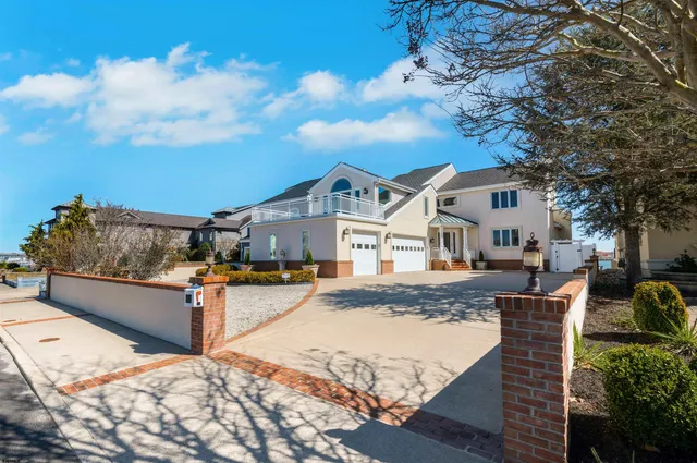 a view of a house with wooden roof and sitting space