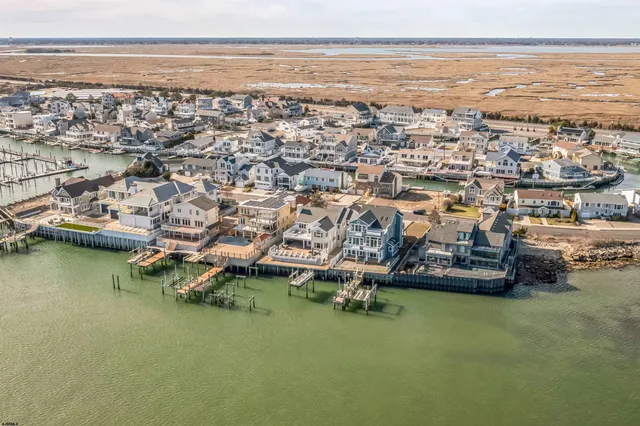 an aerial view of a house with a ocean view