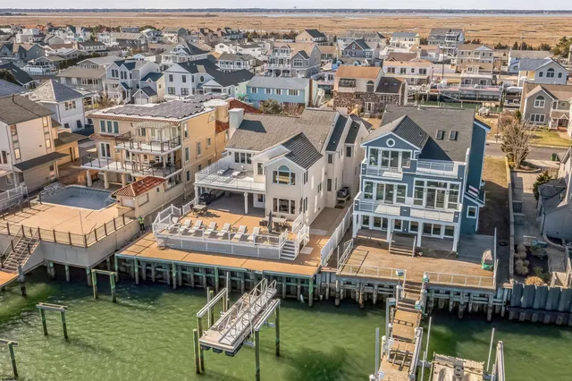 a balcony with table and chairs