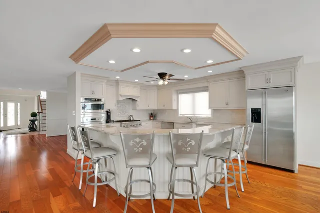a view of a dining area with furniture and wooden floor