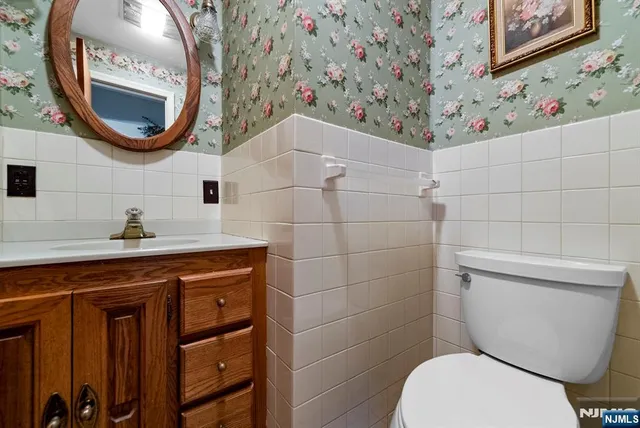 a bathroom with a toilet and a sink