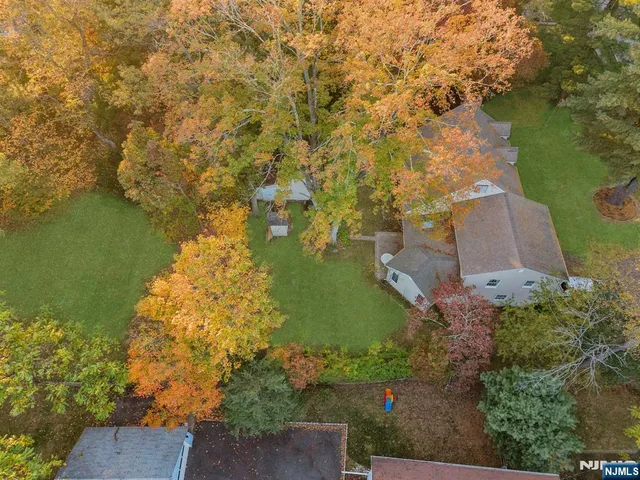 an aerial view of ocean with residential house with outdoor space