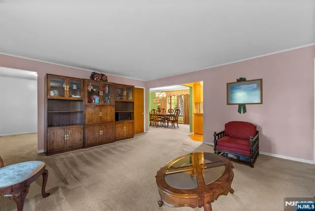 a living room with furniture and a lamp