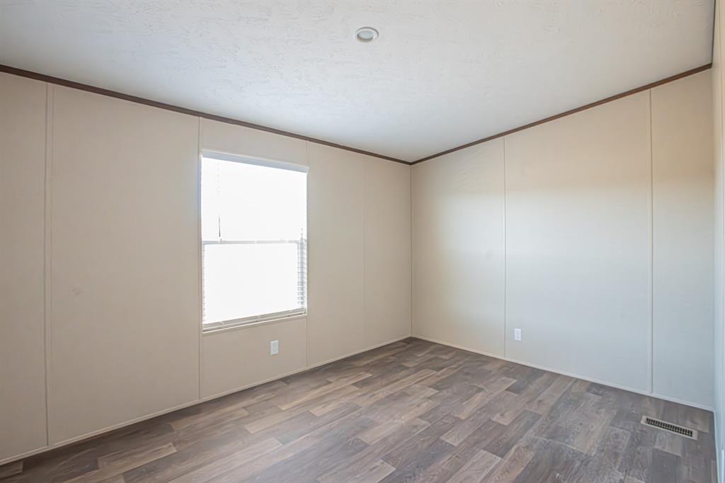 245 Lelon Lane Springtown, TX 76082 - Photo 17 of 37 an empty room with a window