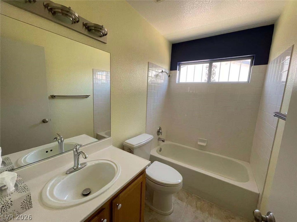 3500 Redwood Ridge Way North Las Vegas, NV 89031 - Photo 11 of 13 Functional full bathroom featuring a tub and shower combination with clean tile surround.