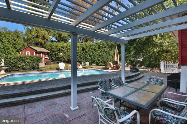 a outdoor space with patio lots of furniture and garden view