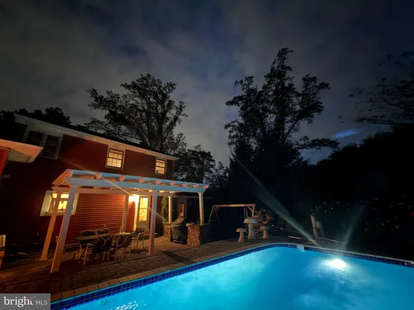 a view of a house with a yard from a backyard