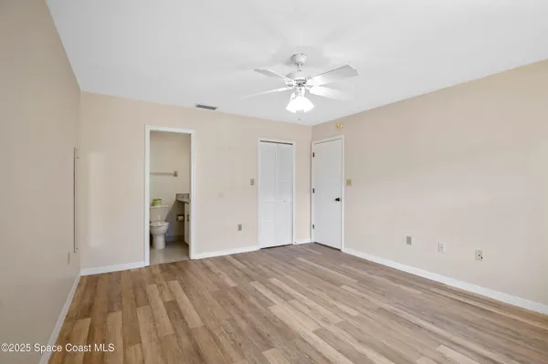 a white toilet sitting next to a shower curtain