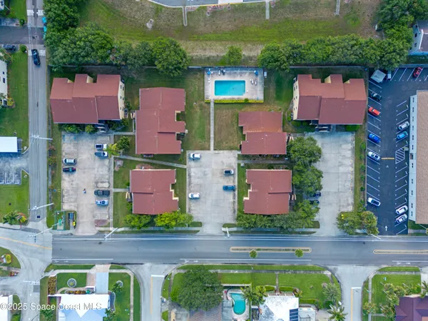 an aerial view of a house with outdoor space
