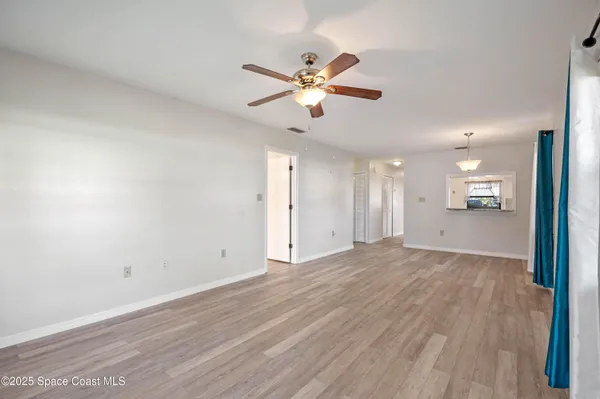 a view of an empty room and window