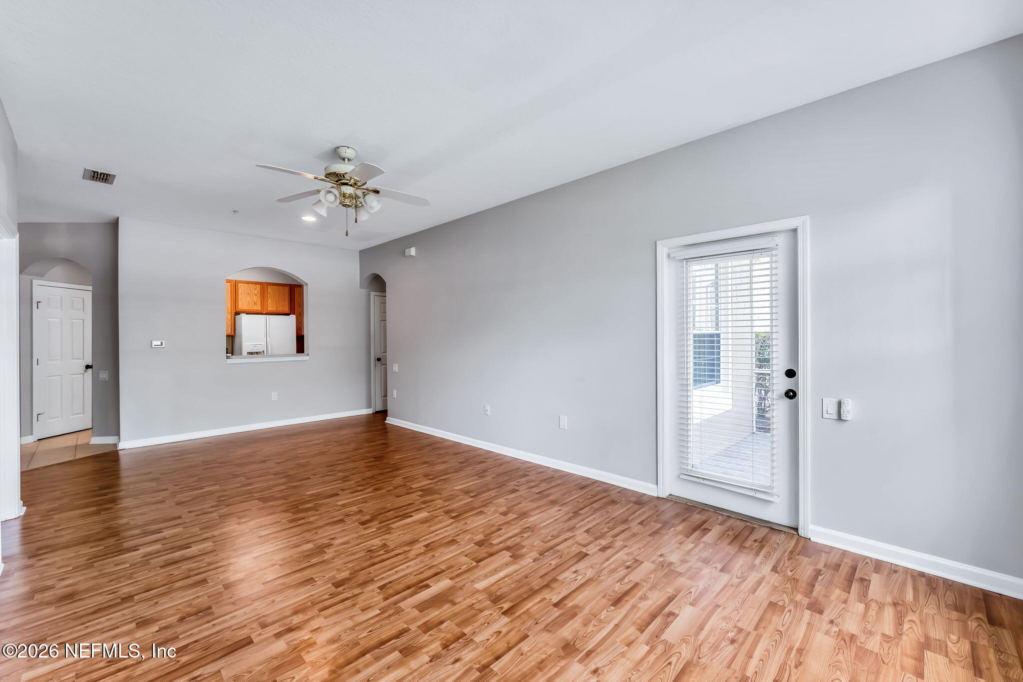 7990 Baymeadows Road East, Unit 520 Jacksonville, FL 32256 - Photo 14 of 41 a view of an empty room with wooden floor and a window