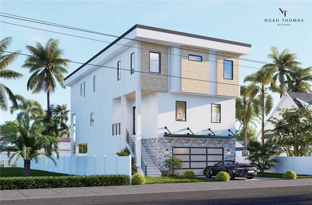 541 Normandy Road Madeira Beach, FL 33708 - Photo 2 of 9 a front view of a house with a yard