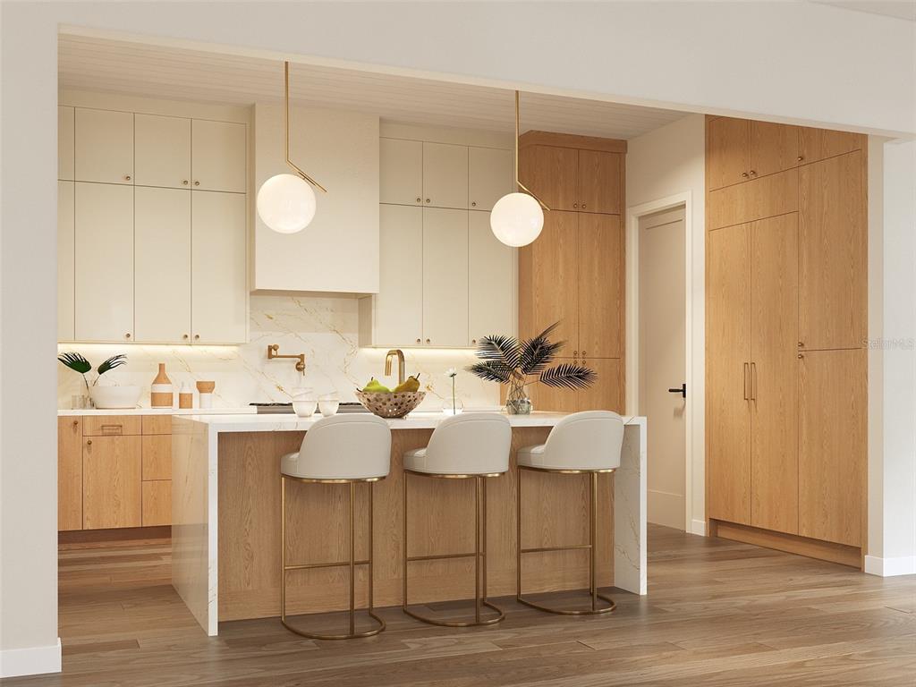 541 Normandy Road Madeira Beach, FL 33708 - Photo 5 of 9 a view of kitchen island with furniture and wooden floor