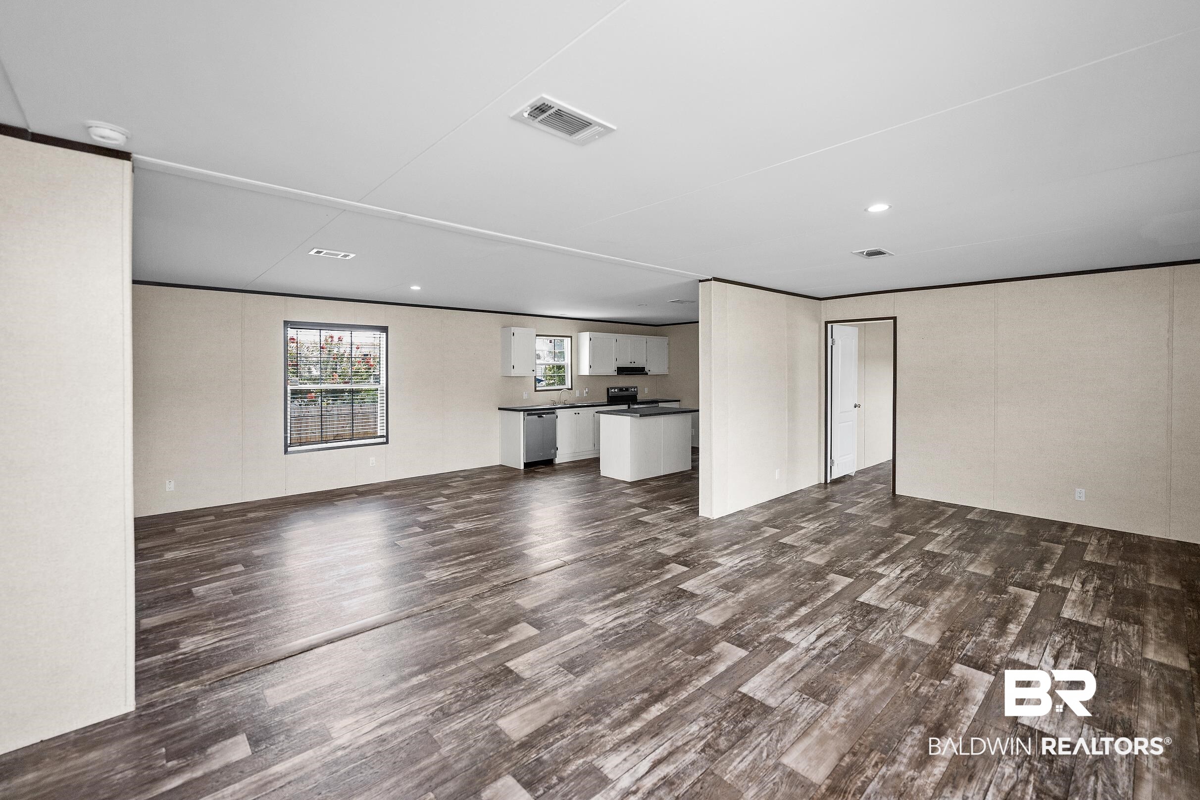 21601 Westside Loop Silverhill, AL 36576 - Photo 10 of 42 Spacious open-concept living area featuring wood-finish flooring throughout