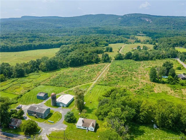 an aerial view of a house with yard