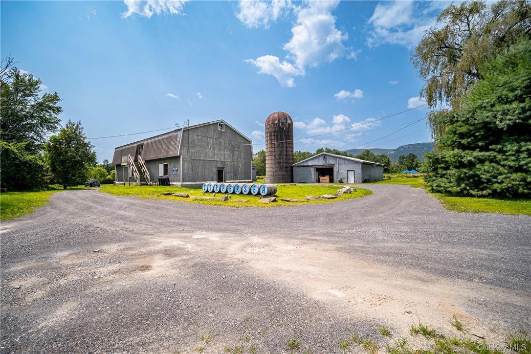 239 Springtown Road New Paltz, NY 12561 - Photo 16 of 36 a view of a swimming pool with an outdoor space and seating area